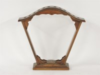 Lot 367 - A walnut twelve stick stand