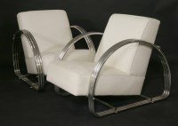 Lot 555 - A pair of contemporary tubular chrome armchairs