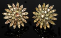 Lot 261 - A pair of foiled topaz flower head cluster earrings