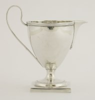Lot 192 - A George III silver helmet cream jug