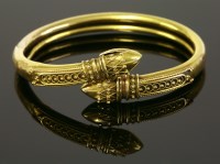 Lot 308 - An Etruscan-style Victorian gold bangle of crossover form
