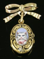 Lot 375 - A French gold and enamel oval hinged photo locket