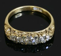 Lot 336 - An Edwardian five stone diamond carved head ring