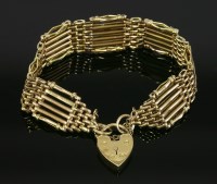 Lot 369 - An Edwardian six-row gold gate bracelet