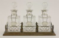 Lot 114 - A set of three small silver-mounted cut glass spirit decanters