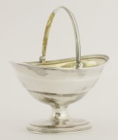 Lot 150 - A George III silver swing-handled sugar basket