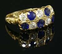 Lot 328 - An 18ct gold sapphire and diamond two-row ring