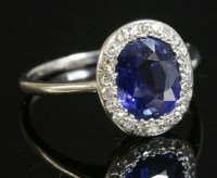 Lot 425 - An Art Deco sapphire and diamond oval cluster ring