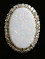 Lot 501 - An opal and diamond oval cluster ring