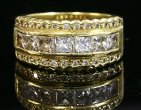 Lot 529 - An 18ct gold diamond set half hoop ring