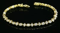 Lot 536 - An 18ct gold diamond line bracelet