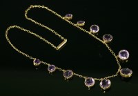 Lot 360 - An Edwardian gold amethyst set fringe necklace