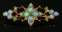 Lot 368 - A cased Edwardian opal and demantoid garnet brooch