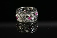 Lot 463 - A synthetic ruby and diamond floral band ring