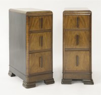 Lot 173 - A pair of Art Deco walnut three-drawer bedside chests
