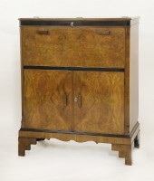 Lot 204 - An Art Deco walnut and ebonised cocktail cabinet