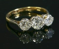 Lot 579 - A graduated three stone diamond ring