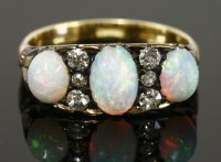 Lot 367 - A late Victorian opal and diamond carved head ring