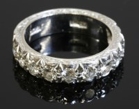 Lot 567 - A white gold diamond set half eternity ring