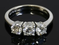 Lot 578 - An 18ct white gold three stone diamond ring