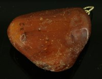Lot 291 - A freeform amber pendant