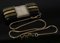 Lot 616 - A silver gilt Art Deco Movado Chronometre Ermeto purse watch