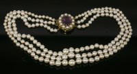 Lot 487 - A three-row graduated cultured pearl necklace