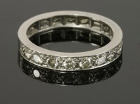 Lot 402 - A white gold diamond set half eternity ring