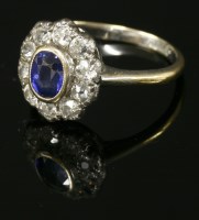 Lot 426 - An Edwardian sapphire and diamond oval cluster ring