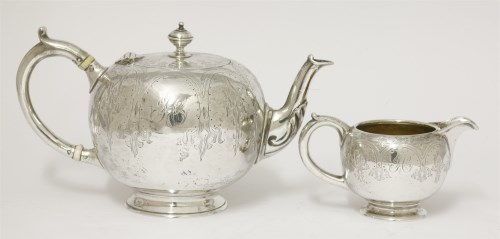 Lot 79 - A Victorian silver teapot and cream jug