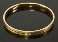 Lot 378 - An Art Deco 15ct gold hollow slave bangle