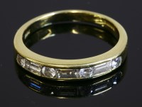 Lot 540 - An 18ct gold diamond set half eternity ring