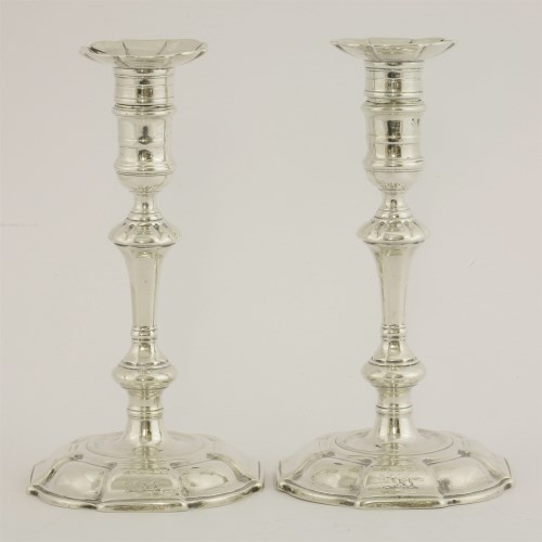 Lot 125 - A pair of George II silver candlesticks