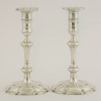 Lot 125 - A pair of George II silver candlesticks