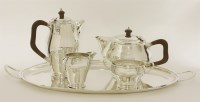 Lot 164 - A four-piece silver tea set with two handled tray en suite