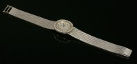 Lot 465 - A ladies' 18ct white gold Longines mechanical diamond set bracelet watch