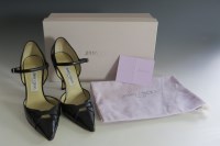Lot 155 - A pair of Jimmy Choo 'Isla' black leather court shoes