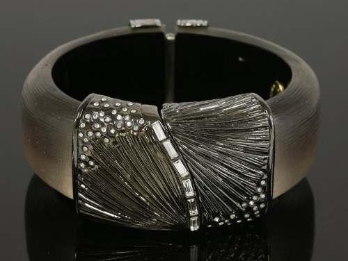 Lot 37 - An hinged Lucite and paste set bangle