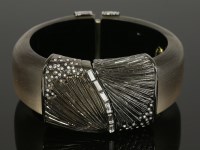 Lot 37 - An hinged Lucite and paste set bangle