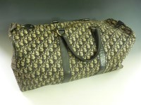 Lot 376 - A Christian Dior woven 'Dior' fabric holdall