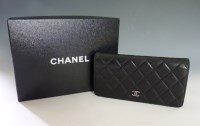 Lot 381 - A Chanel black lambskin leather quilted wallet