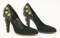 Lot 160 - A pair of Gucci studded black court shoes