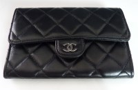 Lot 396 - A Chanel black quilted lambskin purse/wallet
