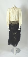 Lot 210 - An Alexander McQueen black lace tiered evening skirt