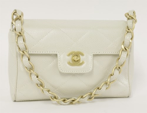 Lot 395 - A Chanel mini iridescent caviar quilted lambskin flap bag