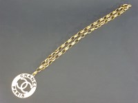 Lot 27 - A gold-plated Chanel oversized pendant and chain