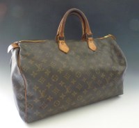 Lot 480 - A Louis Vuitton 'Speedy 40' monogrammed bag
with tan leather handles and gold tone hardware