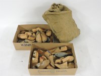 Lot 169 - A box and a sack of carved wooden shoe lasts