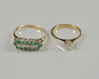 Lot 37 - A 9ct gold diamond and emerald three row cluster ring