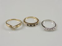 Lot 47 - A 9ct gold diamond set wishbone ring